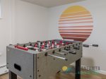 Foosball table by the fantastic mural.